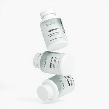 Three bottles of VitalGlow Balance+ supplement on a white background