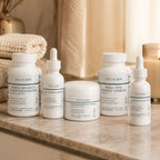 Vitaalskin longevity protocol on a marble surface with a candle and towel in the background