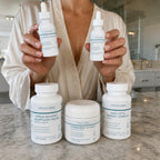 Person holding longevity protocol on a marble countertop